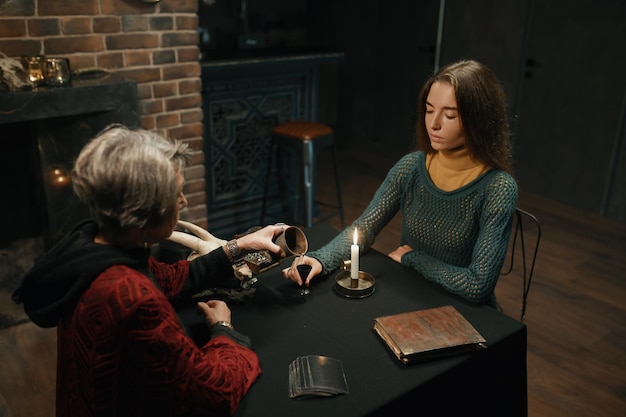 gypsy witch making ritual woman client glowing candle esoteric divination occult mystic ceremony concept 266732 32362